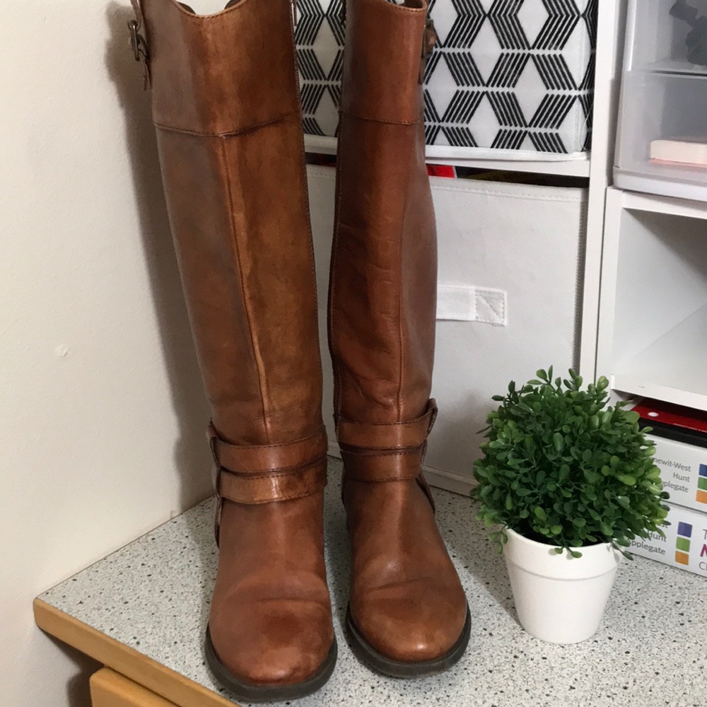 Brown tall boots.